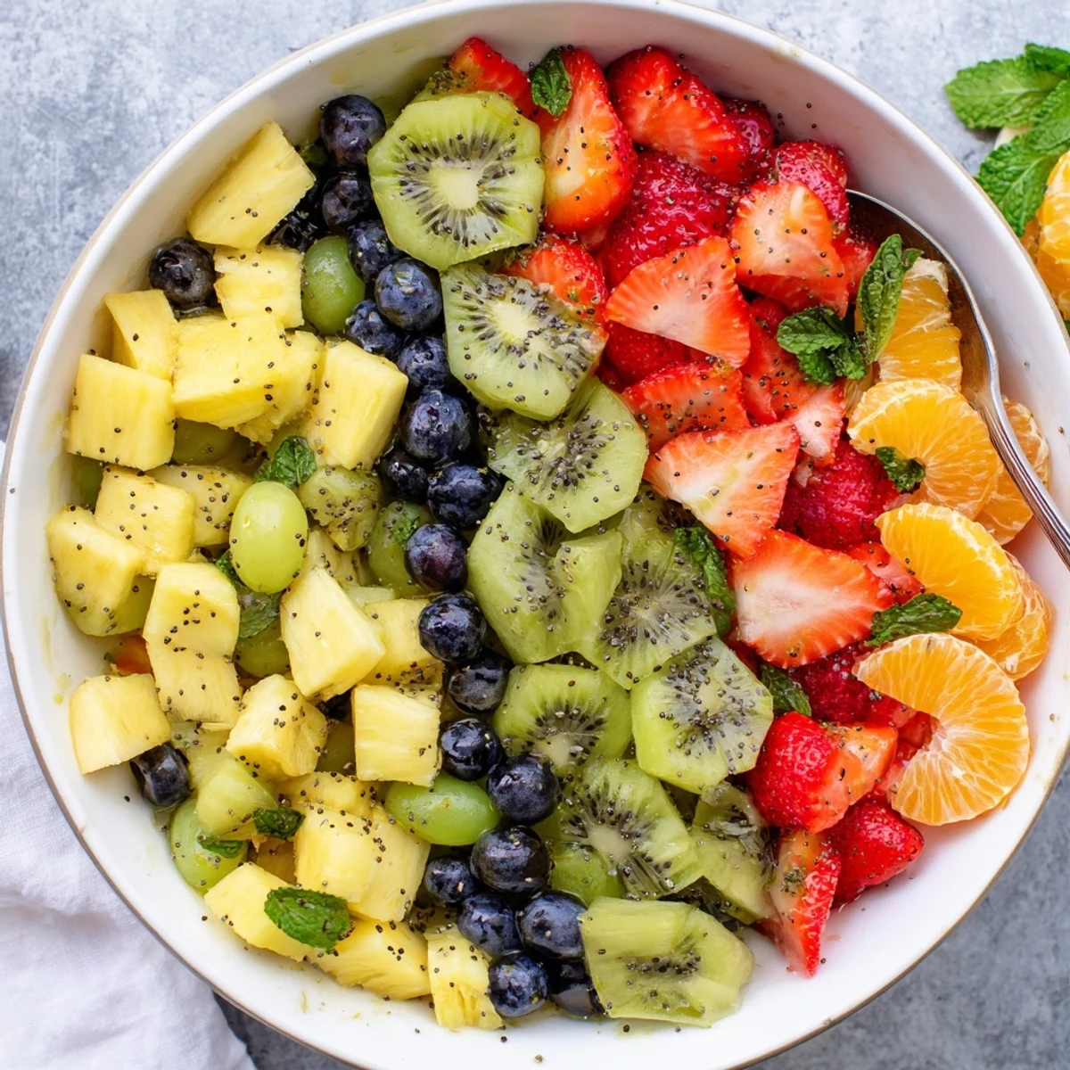 Festive Easter fruit salad arrangement showcasing mixed spring fruits drizzled with citrus glaze and garnish