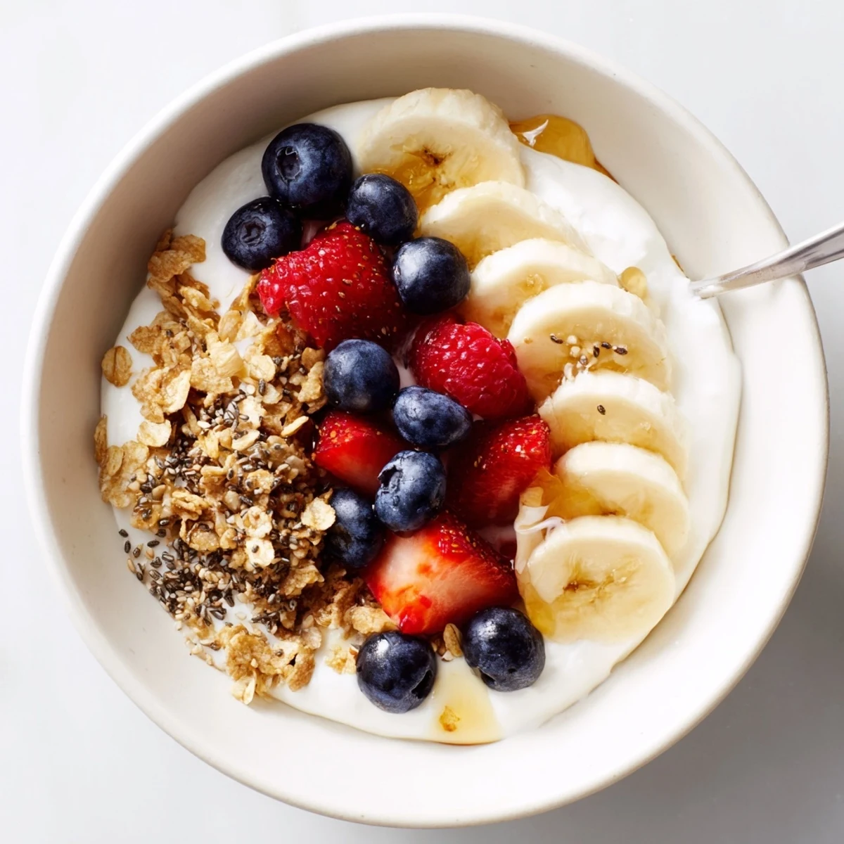 Cottage Cheese Breakfast Bowl with sliced banana, honey drizzle, and chia