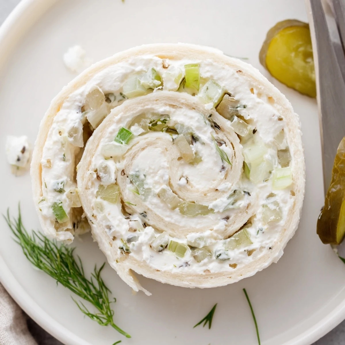Rolled Pickle Dip Pinwheels sliced into bite-sized spirals, tangy crunch  