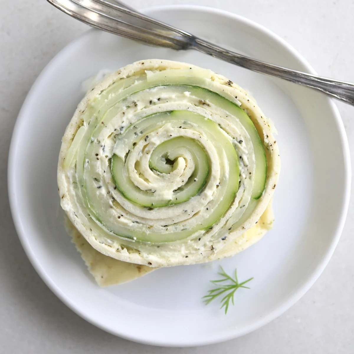 Bright Cucumber And Dill Pinwheels sliced into spirals, perfect for summer parties