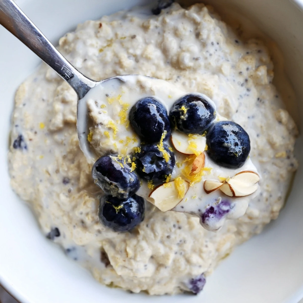 Blueberry Lemon Overnight Oats topped with bright berries and zesty lemon rind.
