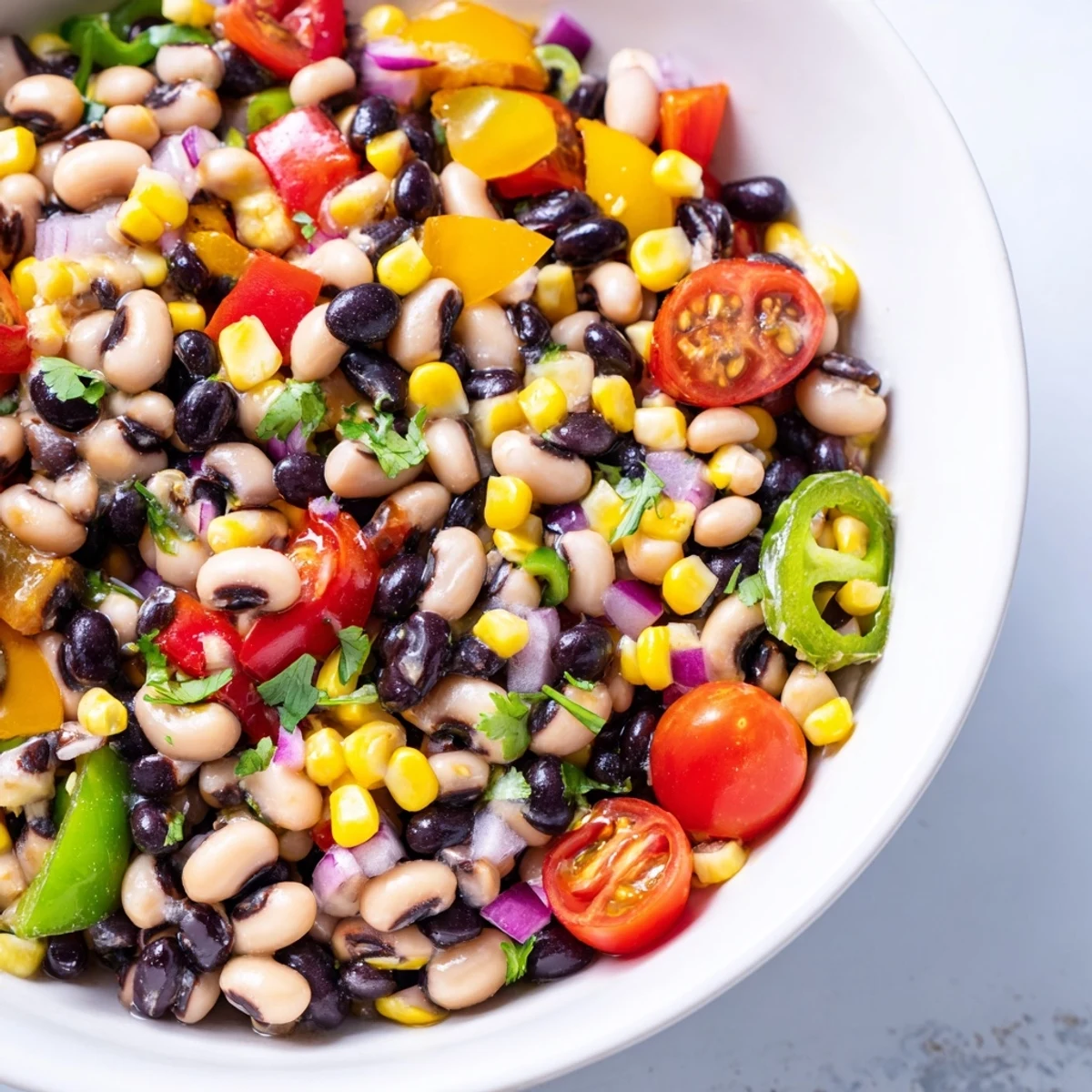 Colorful cowboy caviar bursting with fresh bell peppers and black beans